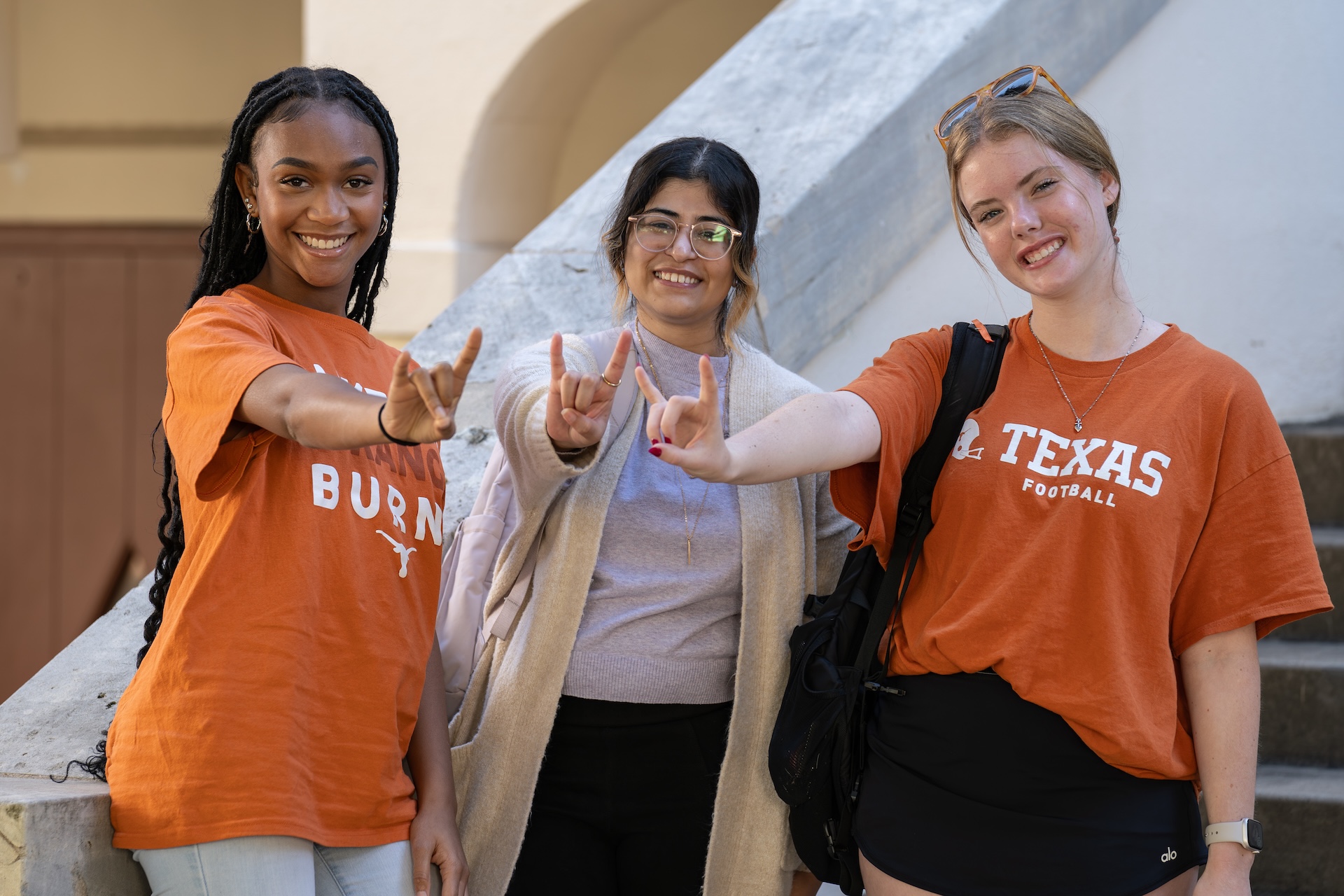 UT fans gesturing Hook'em Horns.